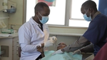 Unilever dentist examines a children in Kenya