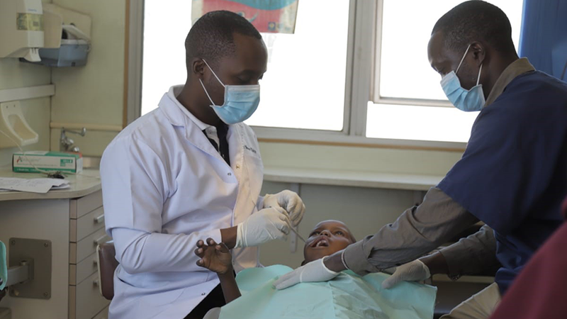 Unilever dentist examines a children in Kenya