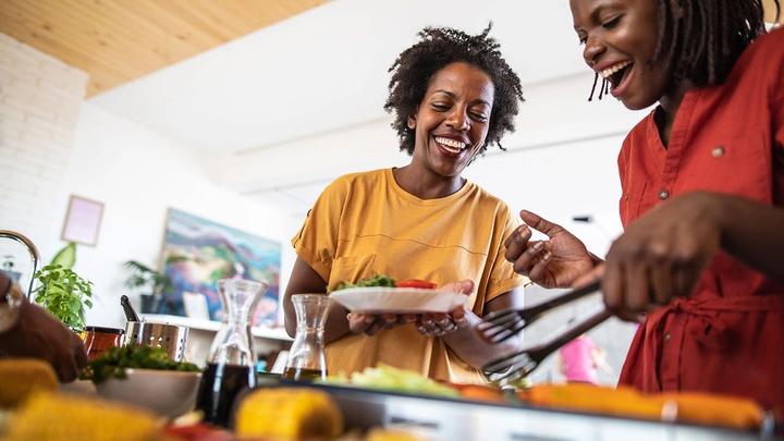 Two women cooking