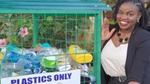 Photo of Draganah Omwange next to a Plastics Only bin