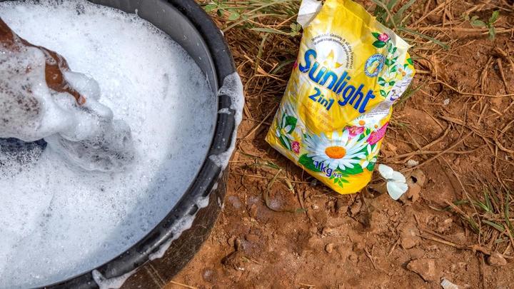 Washing clothes by hand in a bowl