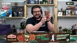 Gaming presenter holding up a Magnum ice cream pint during a live stream.