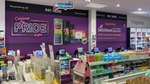 Large 'Celebrate the Pride in you' wall poster showing Pride branded personal care products, and Switchboard contact details.
