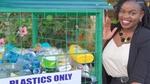 Unilever employee, Draganah Omwange stands next to a recycling bin. She set up this initiative to help reduce plastic waste