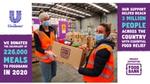 Foodbank volunteers receiving Unilever donation in the factory
