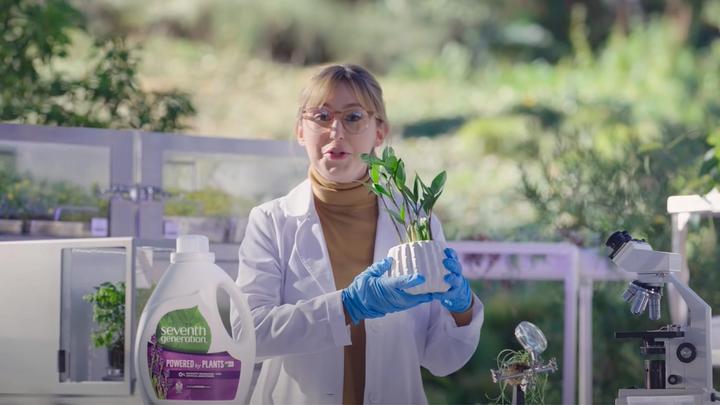 A scientist holding a plant