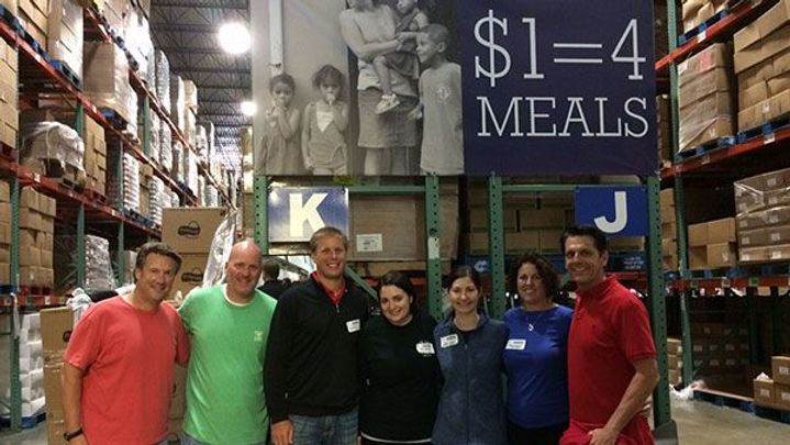A group of people, volunteering for a hunger relief programme