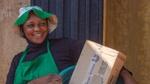 Woman with a basket of cleaning products that she resells as part of Unilever Nigeria’s Shakti project.