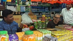 Zaved Akhtar, CEO and Managing Director of UBL, sits in a local retailer's shop and converses with the proprietor