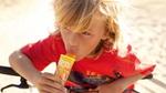 A young boy eating a Calippo