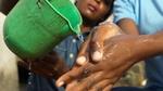 Poring water on hands