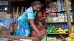 Two women choose Knorr products from a Nigerian market stall