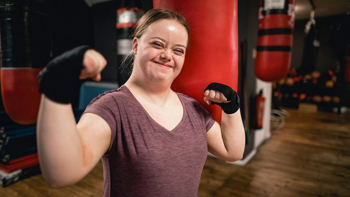 A girl in the gym with her hands wrapped