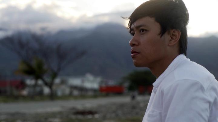 Winarto-Anggun Wicaksono looking thoughtful onto the damage caused by the earthquake in Palu, Indonesia