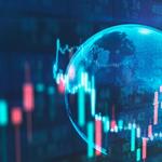 Image of computer screen showing financial market figures with a reflection of the earth in the background