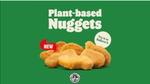 Plant-based chicken nuggets against a green background"
