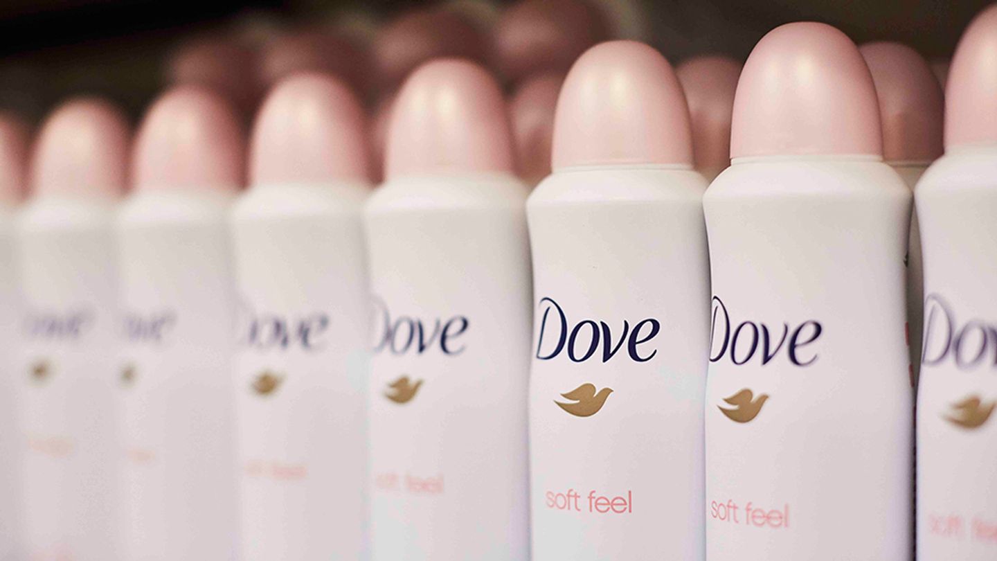 Dove deodorant cans on a shop shelf