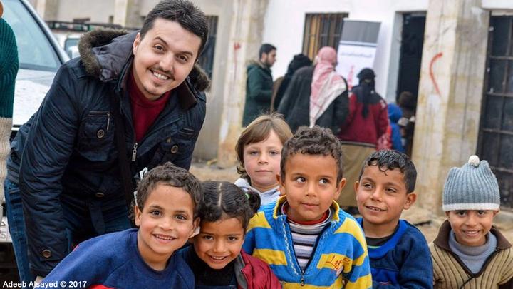 Anas Anjrini with children in Aleppo