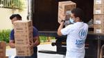 UNHCR representatives unloading boxes full of Unilever’s Rexona at a refugee camp
