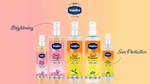 Five bottles of Vaseline's Summer spray, now available in India. Two bottles are pink, three are orange.