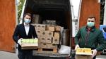 Unilever products, donated to a hospital, being unloaded from a van by two men wearing surgical masks