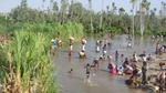 Villagers in Magadgascar using river for drinking water and domestic use