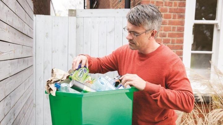 Man recycling his household waste