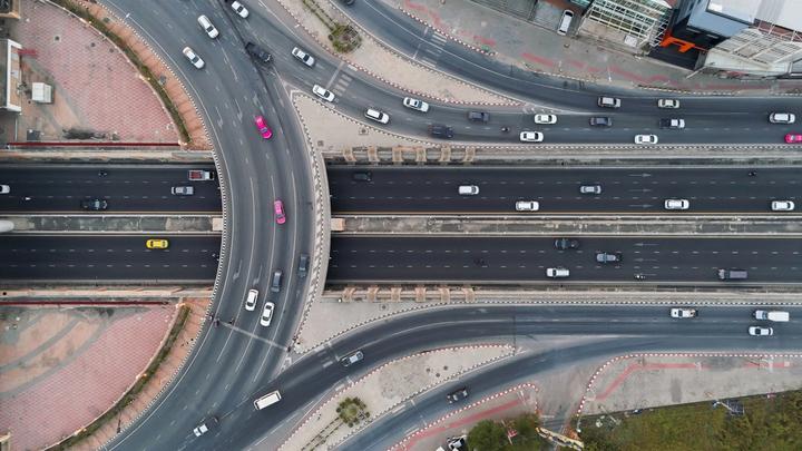 An aerial view of cars driving around a motorway junction