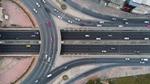 An aerial view of cars driving around a motorway junction