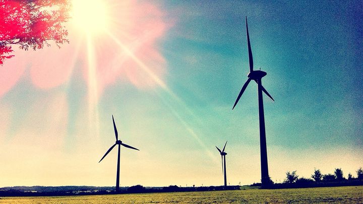Wind turbines against a blue sky