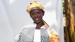 AWA, Magnum’s digital ambassador, wearing a yellow headscarf and black and white dress designed by Rebecca Zoro