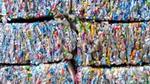Plastic packaging flattened into six large bales