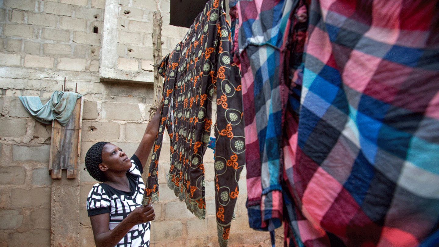 Woman hanging clothes