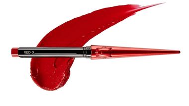 An image of Hourglass Glossy Balm, a soft rose pink lipstick in a gold case. The background matches the shade of lipstick.