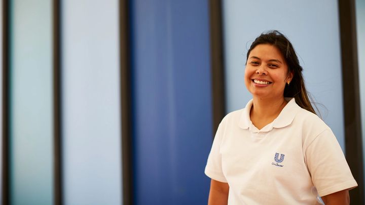 Woman wearing a Unilever t-shirt at our factory in Brazil