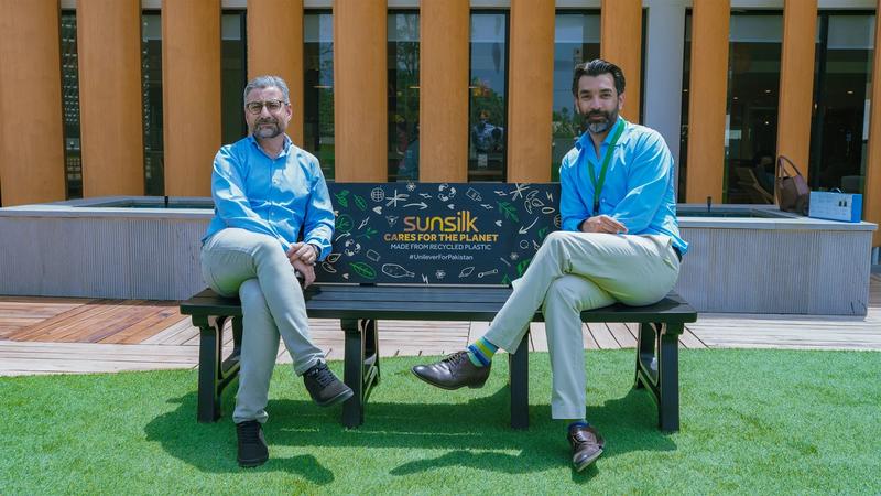 Amir Paracha along with Babar Aziz Bhatti,Director,Green Earth Recycling sitting on a bench made out of recycled plastic