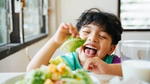 A child eating a plant-based diet