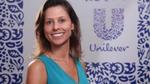 Unilever Hero Juliana Abreu, smiling, with Unilever-branded background
