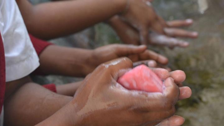 An image of a child washing hands with Lifebuoy soap