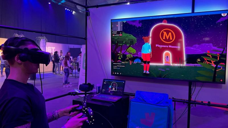 Young person wearing a VR headset controlling an avatar entering Magnum’s Pleasure Museum in the metaverse