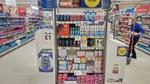 Promotional end of aisle stand containing Unilever products with the partnership branding