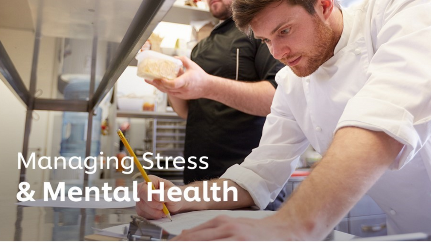 Image shows person working in kitchen with text 'Managing stress & mental health'