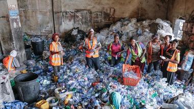 People sorting recycling