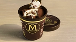 Pack shot of an open cracking chocolate ice cream tub, with Magnum branding