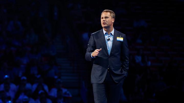 Doug McMillon, Walmart CEO, speaking on stage in front of an audience