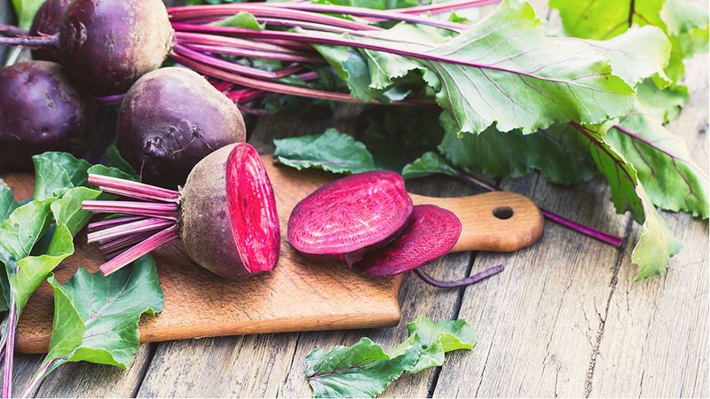Image of beetroot on table and chopping board