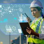 Woman in a hard hat with factory in the background with computer graphics overlaid on the image