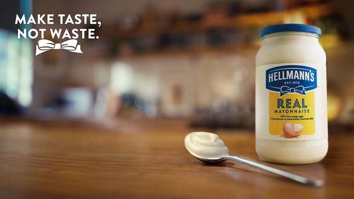 A jar and spoon of Hellmann’s mayonnaise showcasing the brand’s Make Taste, Not Waste campaign