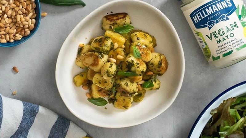 Image shows Gnocchi on a plate next to a tub of Hellmann’s Vegan Mayo