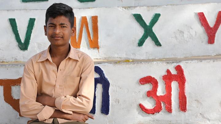 India schoolboy, Virendra, in his school yard.